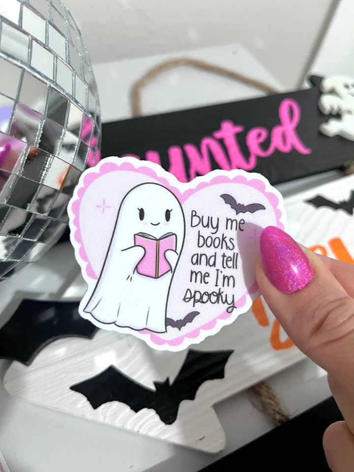 Buy Me Books and Tell me I’m Spooky Vinyl Sticker for wholesale by Illie Millie Designs