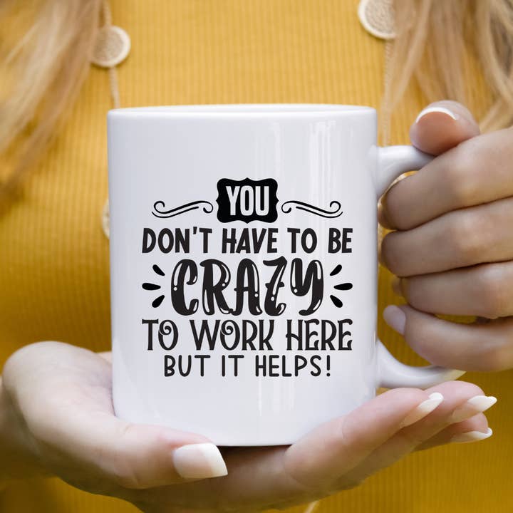 You Don't Have To Be Crazy To Work Here But It Helps! Mug for wholesale by Mug Boss Inc.
