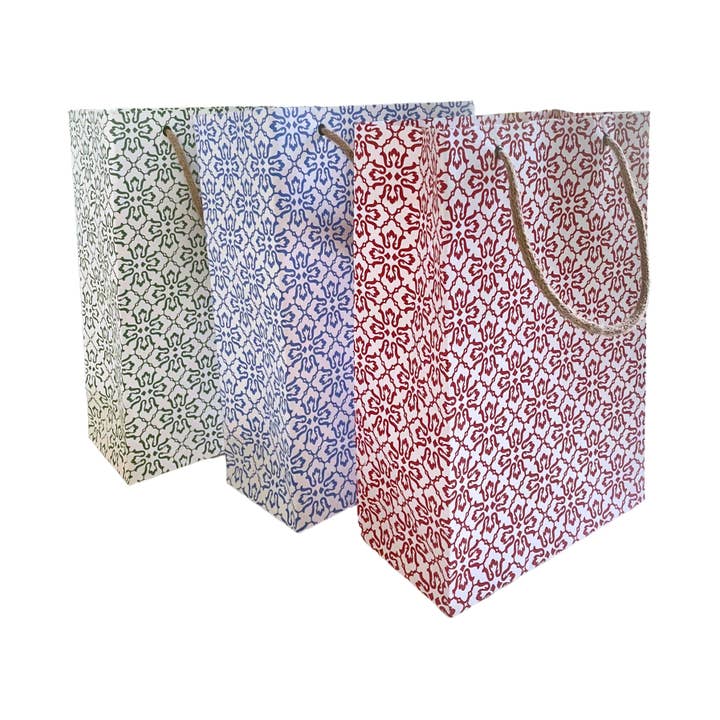 Sustainable Gift Bag | Medium and other Purchase Wholesale recycled paper bags with handles. Free Returns & Net 60 Terms on Faire trending on Faire.