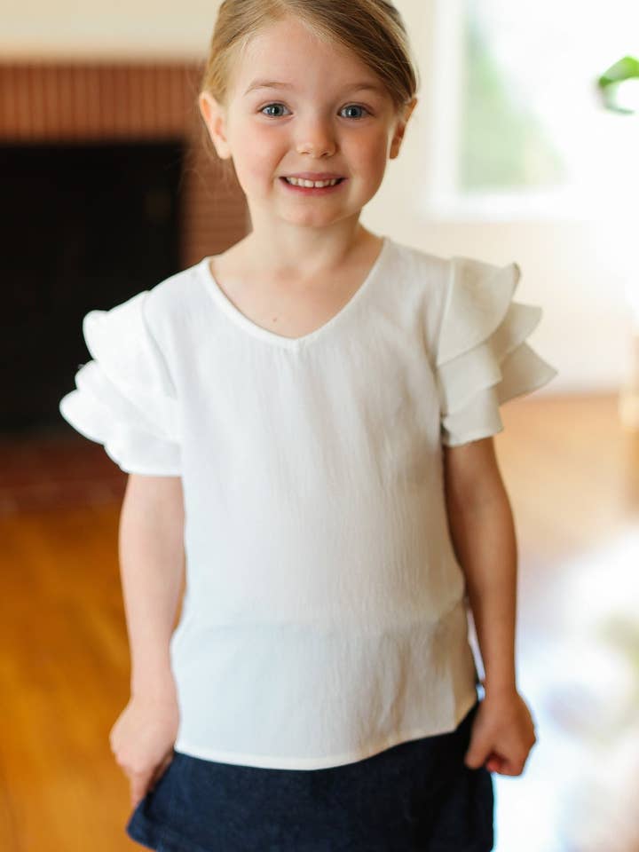 Kids Lovable Linen Feel V Neck Ruffle Sleeve Top (Open Pack) for wholesale by Promenade
