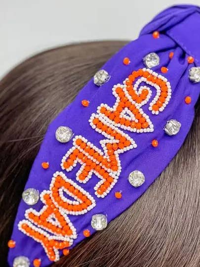 'Game Day' Pyntede pandebånd - Lilla & Orange for engroshandel hos Prep Obsessed Wholesale