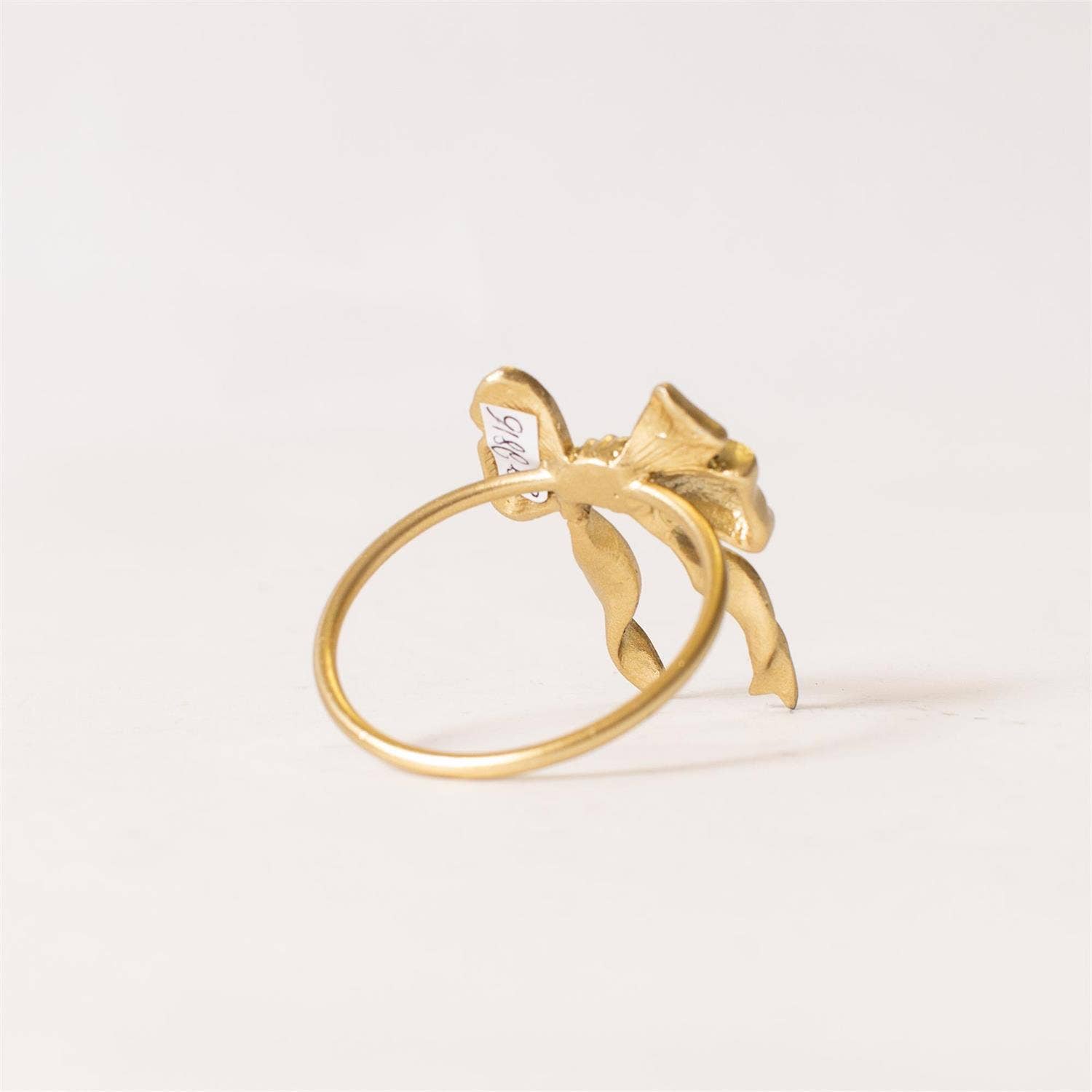 Audrey's Home & Gift - Vente Décorations de table - Rond de serviette - Nœud finition or (PK/12)1