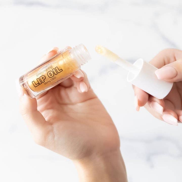 Moisturizing Lip Oil with CBD, Vitamin E - Shimmering Gold for wholesale by Twine