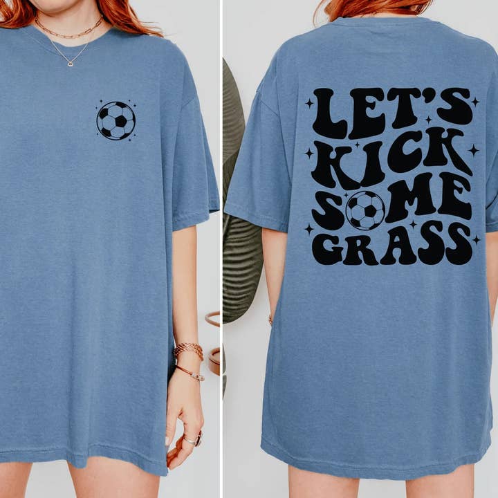 Let’s Kick Some Grass Soccer T-Shirt | Funny Soccer Graphic Tee | Game Day Shirt | Sports Mom Shirt | Soccer Player Shirt for wholesale by Swain Co. Embroidery & Press
