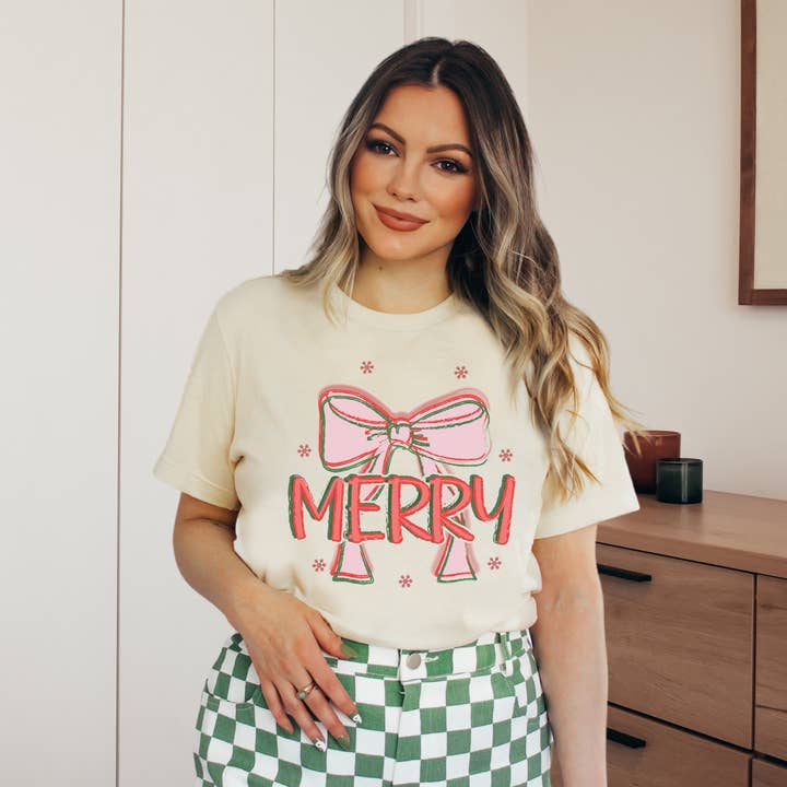 Merry Bow Tee Holiday Graphic Tees for wholesale by Amy Anne Apparel Inc