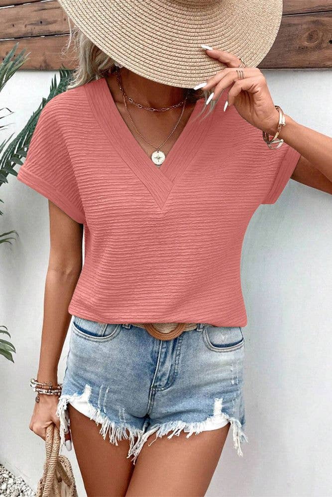 UNISHE - Venta al por mayor Jersey corto de punto - Mujer - Top de manga corta con cuello en V con textura lisa ZK158912