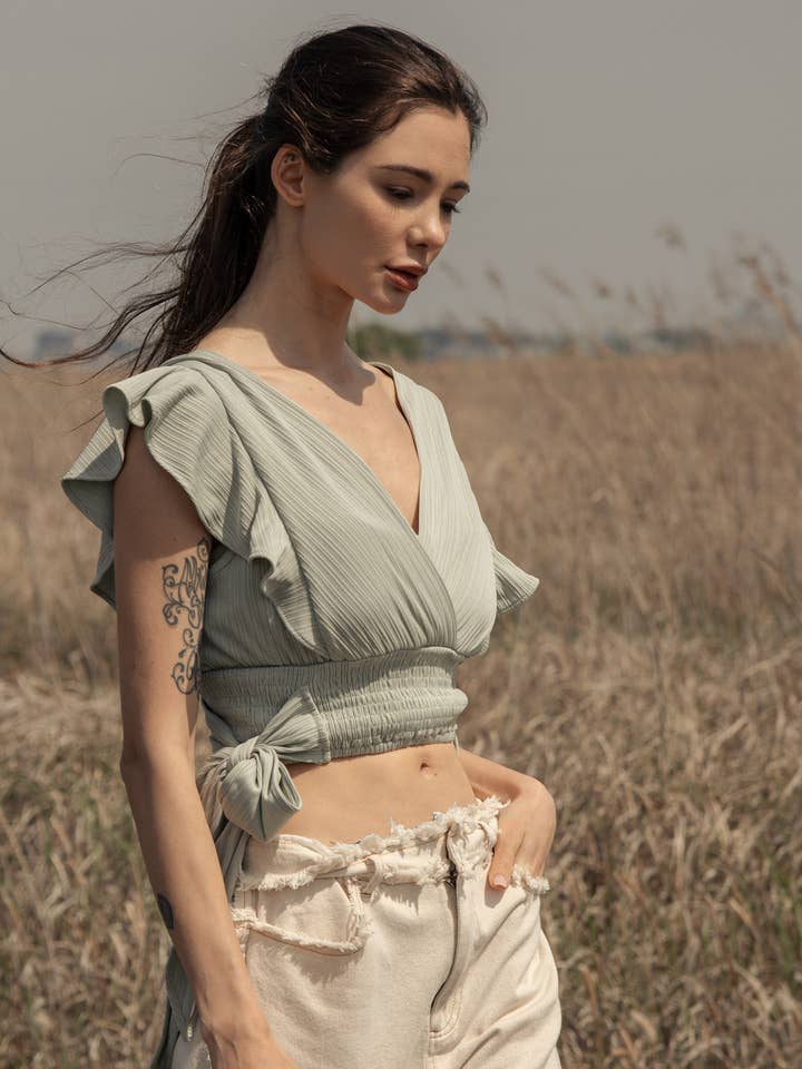 V Neck Top with Ruffle Shoulder and Waist Tie for wholesale by Mello.