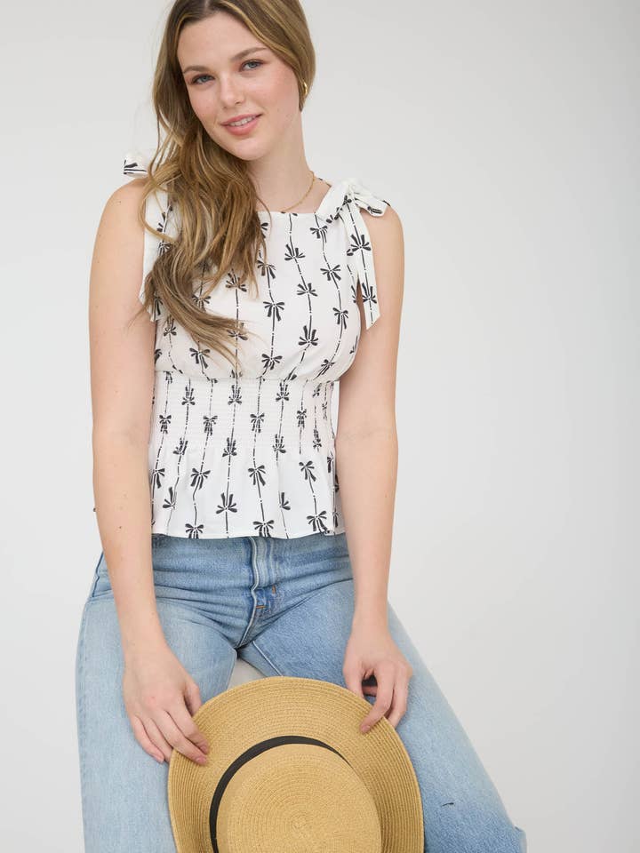 Blusa senza maniche con fiocco e spalline annodate. per la vendita all'ingrosso da parte di Blu Pepper