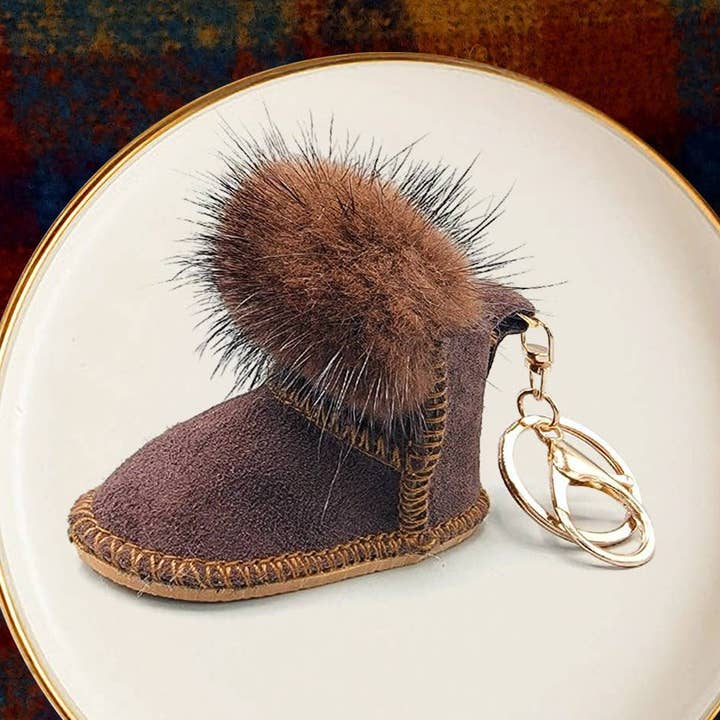 Atractivo llavero de piel sintética con pompones para botas, varios colores para venta al por mayor de Buddha Yoga