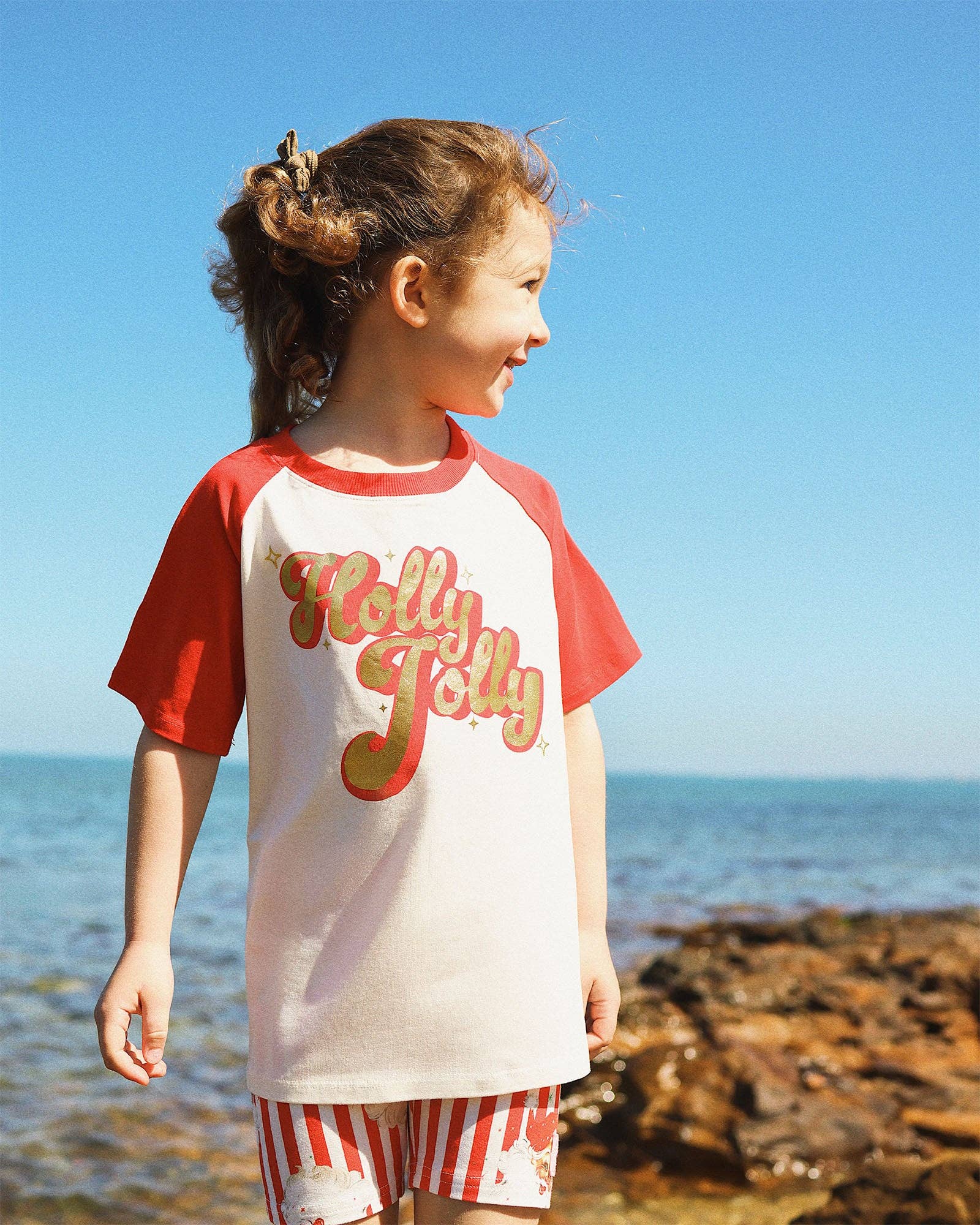 Snow Cone HOLLY JOLLY KYLIE RAGLAN T-SHIRT for wholesale on Faire