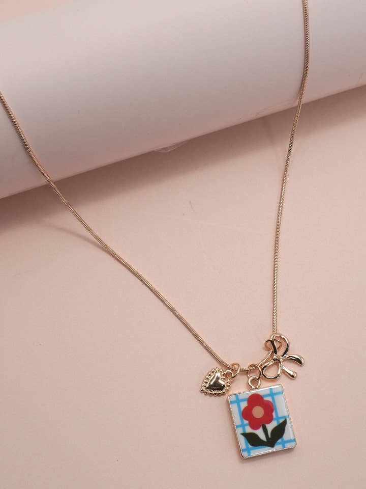 PORCELAIN CLUSTER CHARM BOW HEART NECKLACE | 80N91840 for wholesale by JOSSLYN by wall to wall