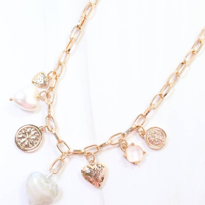 Linden Heart Charm Necklace Gray and other Purchase Wholesale linden. Free Returns & Net 60 Terms on Faire trending on Faire.