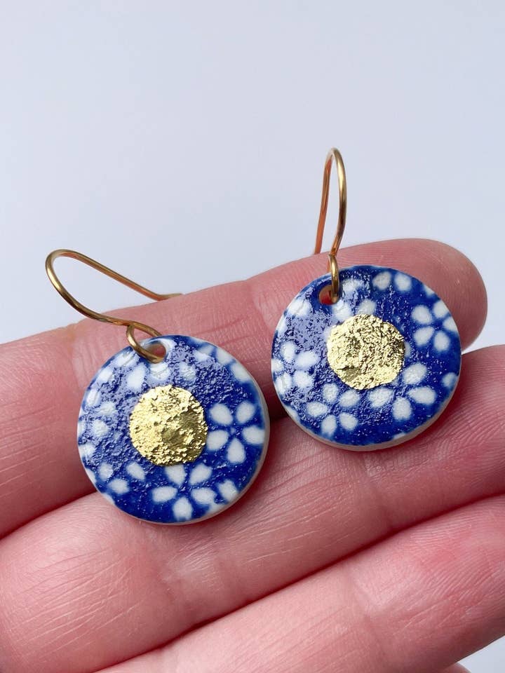 White Flower on Blue Dangle earrings w gold centre for wholesale by Clay Blanca
