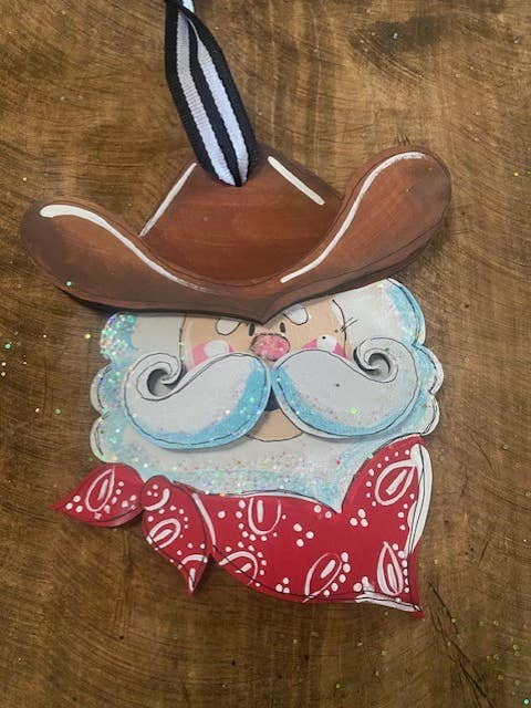 Cowboy Santa hand painted Christmas ornament for wholesale by Pink Fish Studios, LLC.