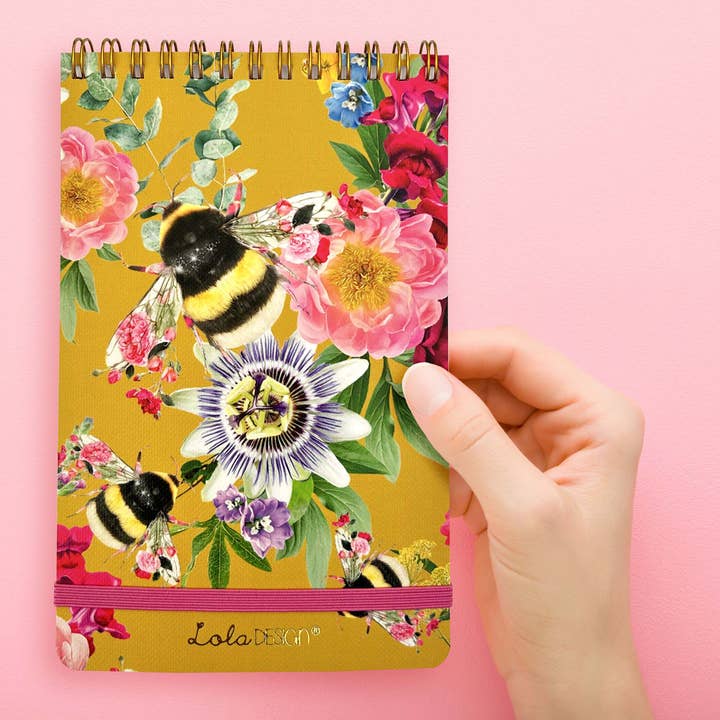 Mustard bee pattern top spiral notepad with elastic closure for wholesale by Lola Design Ltd