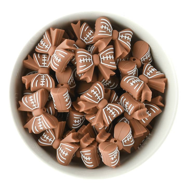 Football Bow Silicone Focal Beads for wholesale by Cara & Co Silicone Craft Supply