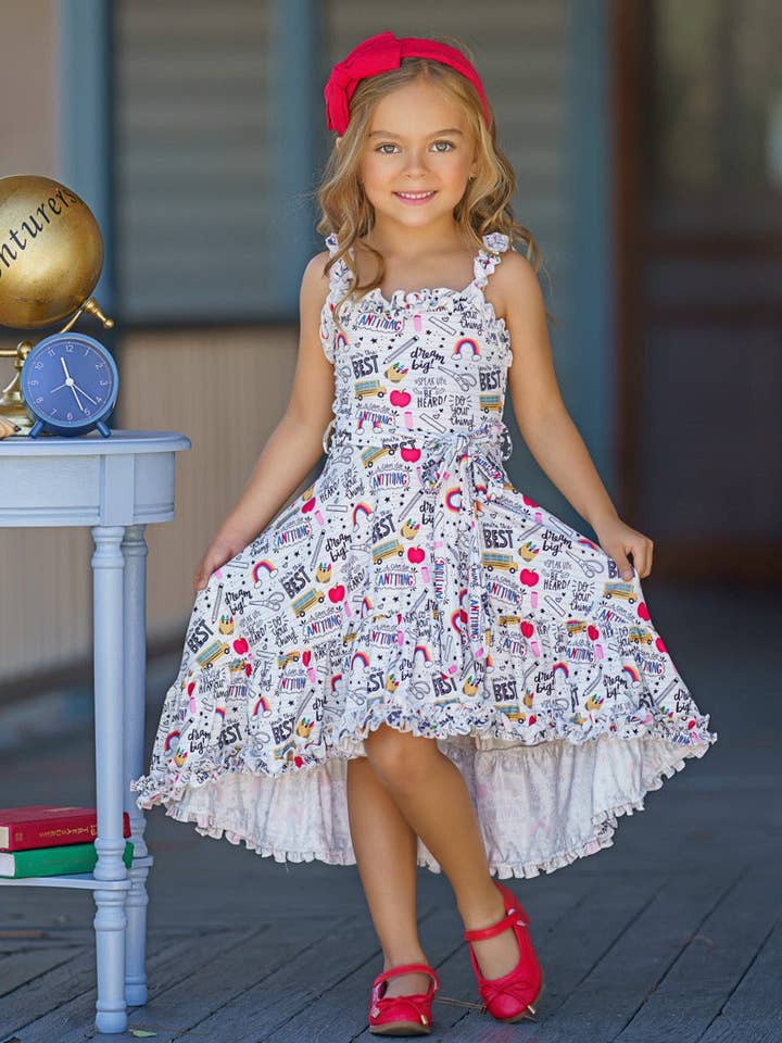 School Doodle Hi-Lo klänning med volanghaklapp, fåll och bälte för wholesale av Mia Belle Girls • Wholesale