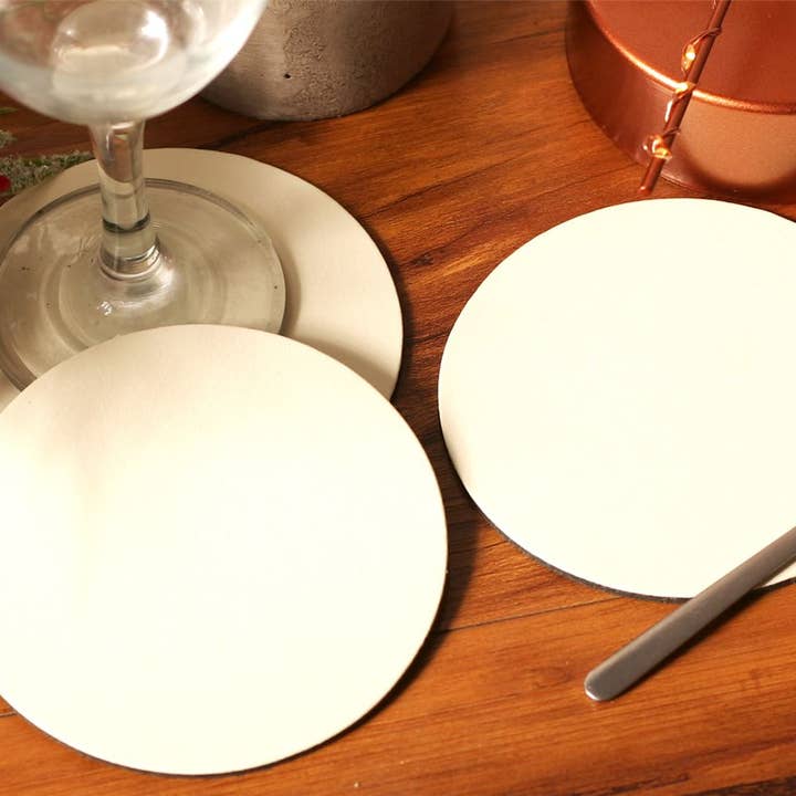 Set of 4 Ivory Elementary Round Leatherboard Coasters for wholesale by The Dapper House