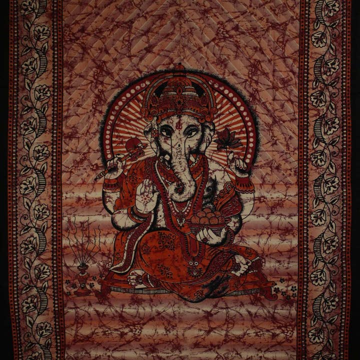 Red Ganesha Holding Lotus Flower In Batik Style Tie Dye Tapestry for wholesale by Wild Lotus