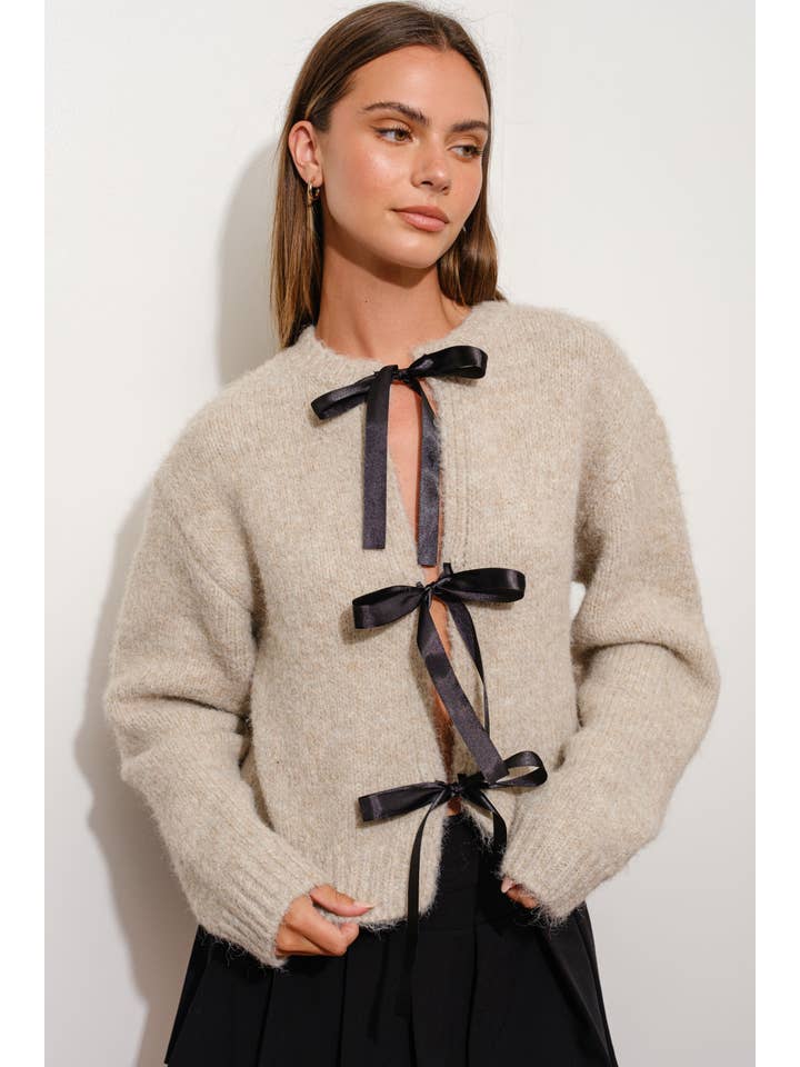 SAND SATIN BOW CARDIGAN for wholesale on Faire