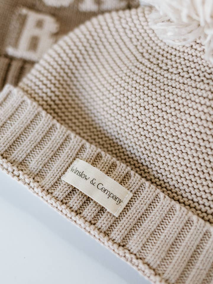 Oatmeal Pom Pom Hat for wholesale by Winslow & Company