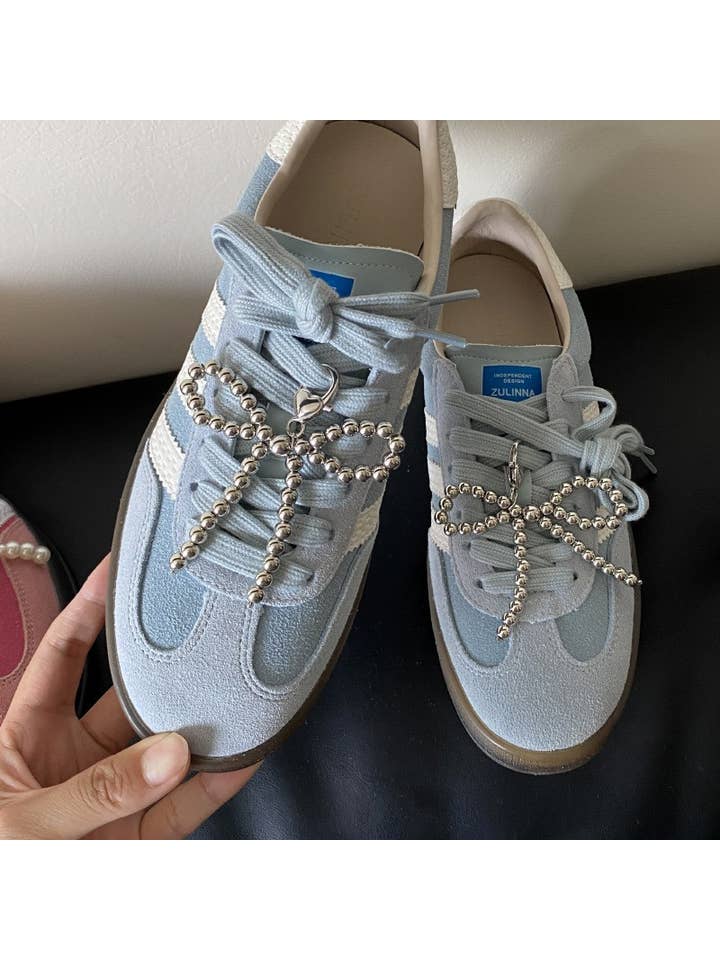 Silver CLASSIC BALL CHAIN BOW RIBBON SHOE PAIR CHARM | 40SD105 for wholesale on Faire1