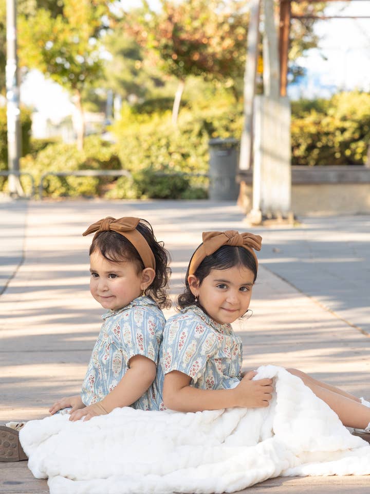 Manta de piel sintética para bebé Cuddle Cookie, color marfil liso para venta al por mayor de Cuddle Cookie Baby Shop