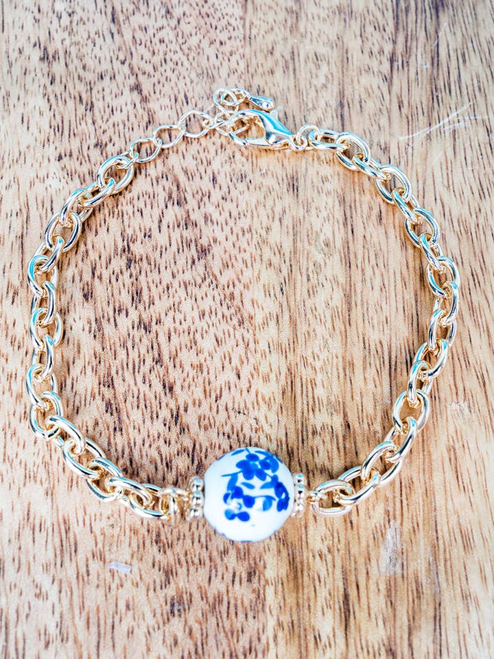 Viola Blue Memory Bloom Goldtone Bracelet for wholesale by Wholesale Accessory Market