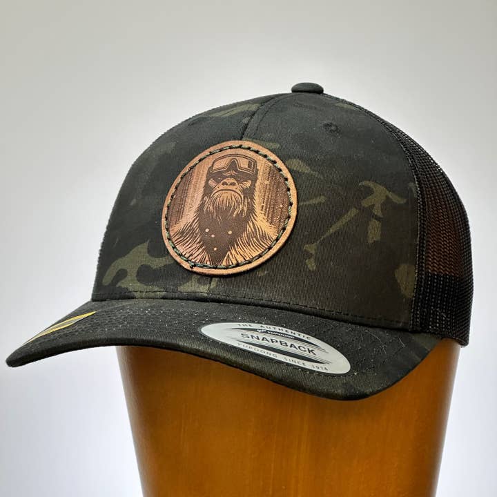 Last Best Supply Co – wholesale Trucker hat – Unisex – Bigfoot Face Thick Stitch Leather Trucker Hat