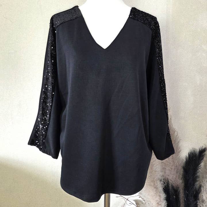 Soft scuba fabric dressy V-neck top with sequin detail on arms and bow on back (M) for wholesale by Tempest Designs