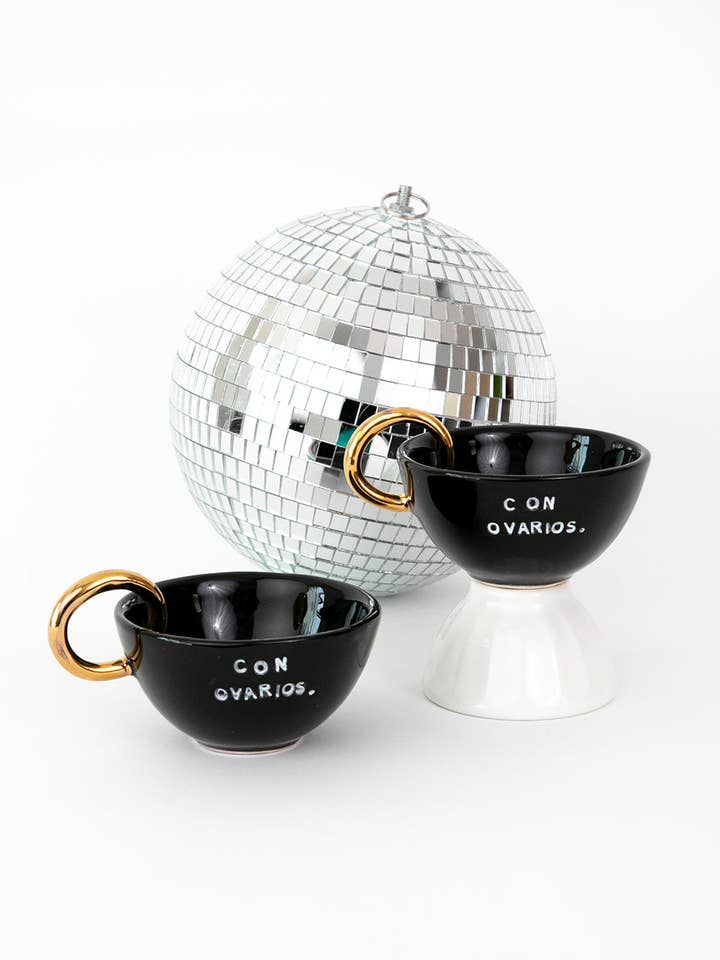 24K Gold Ceramic Con Ovarios.® Cappuccino Mug In Black for wholesale by NYTAQ™