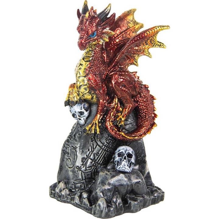 Set di 4 statuette di drago in poliresina - Su rocce con teschi per la vendita all'ingrosso da parte di Kheops International