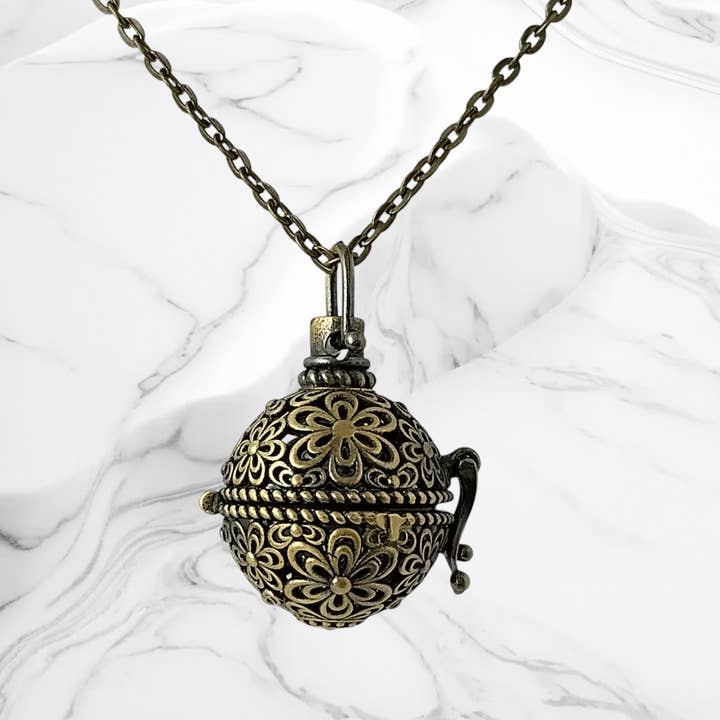 Bronze Aromatherapy Cage Locket with charcoal ball and other Purchase Wholesale locket pendants. Free Returns & Net 60 Terms on Faire trending on Faire.