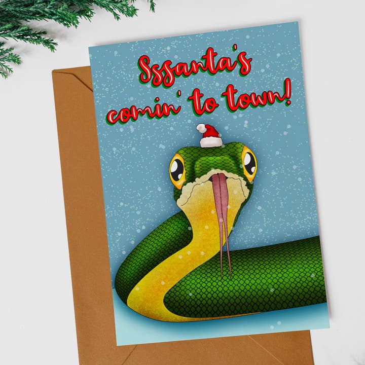 Sssanta’s Coming to Town Santa Snake Christmas Greeting Card for wholesale by Jelly Jean Designs
