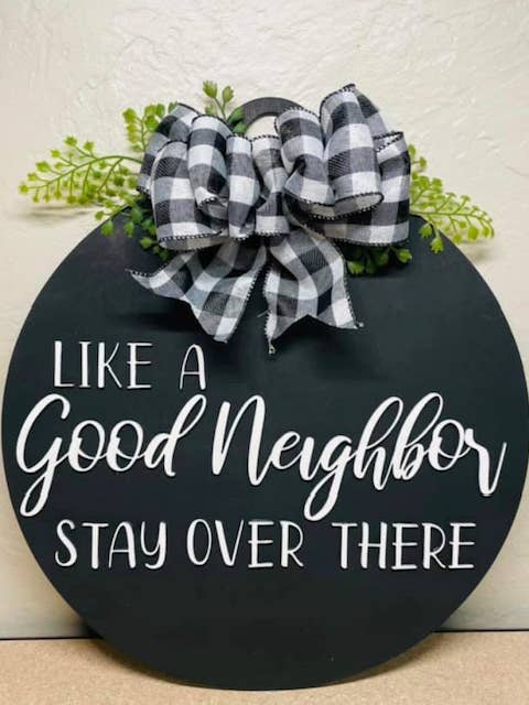 Like A Good Neighbor Wood Door Hanger for wholesale by Mimi and Me Boutique