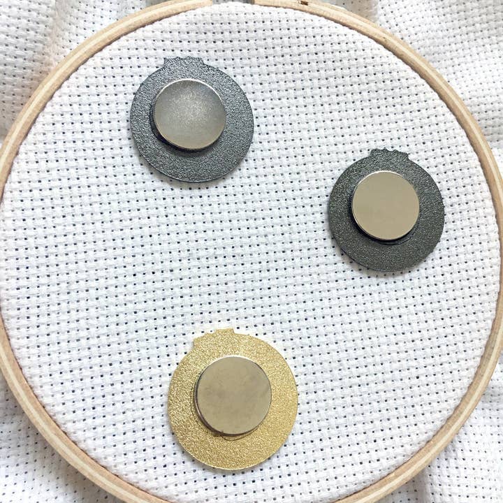 Snarky Crafter Designs - Wholesale Knitting/Crochet Supplies - Just One More Row Cross Stitching Enamel Needle Minder