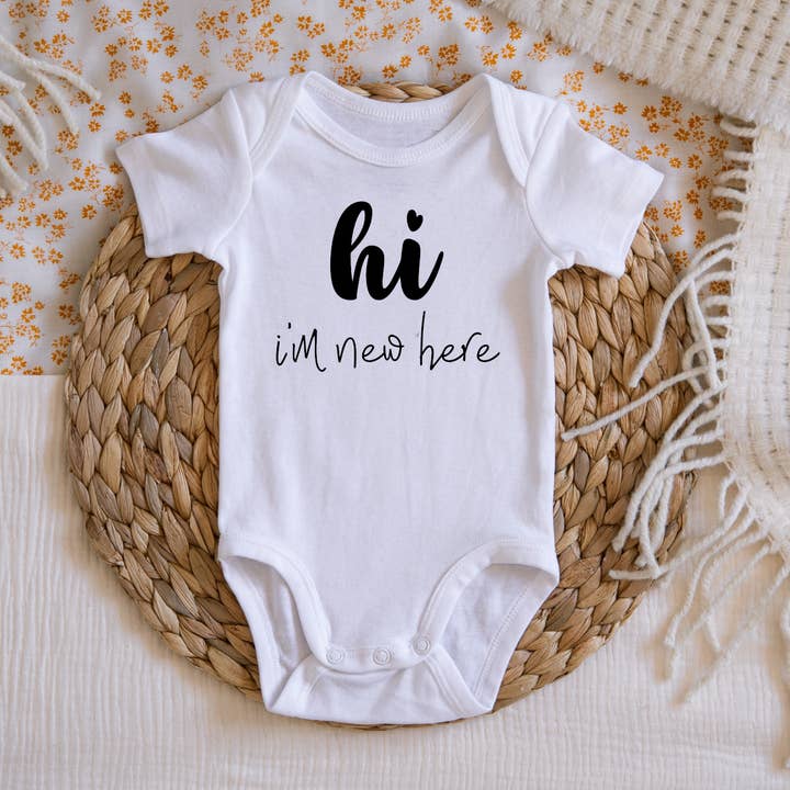 Hi I'm New Here Baby Announcement Onesie for wholesale by Claire and Bella