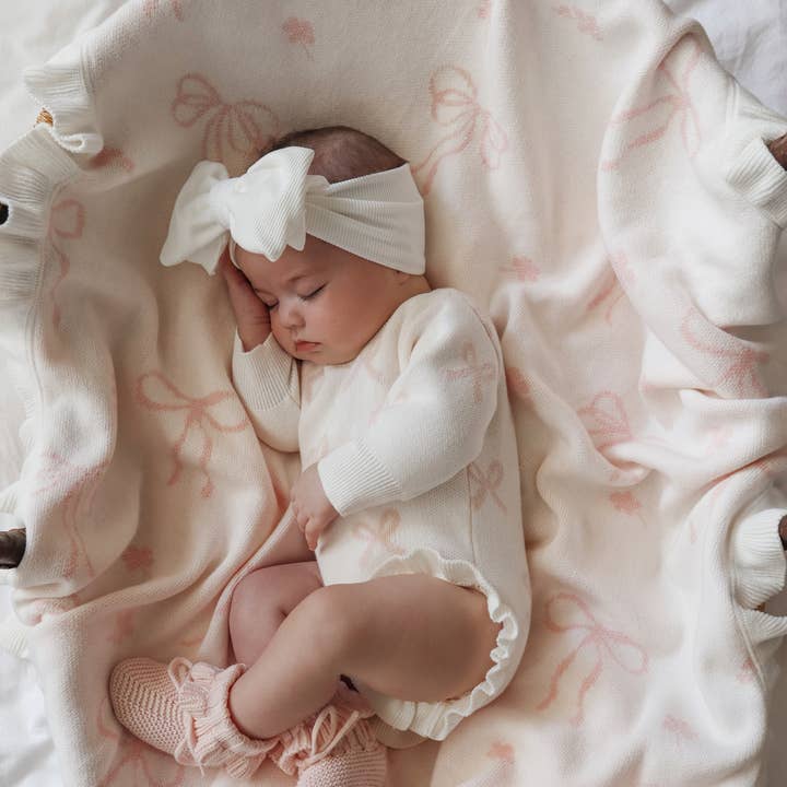 FLORAL BOW BLANKET | MILK + BABY PINK and other Purchase Wholesale knit blanket patterns. Free Returns & Net 60 Terms on Faire trending on Faire.