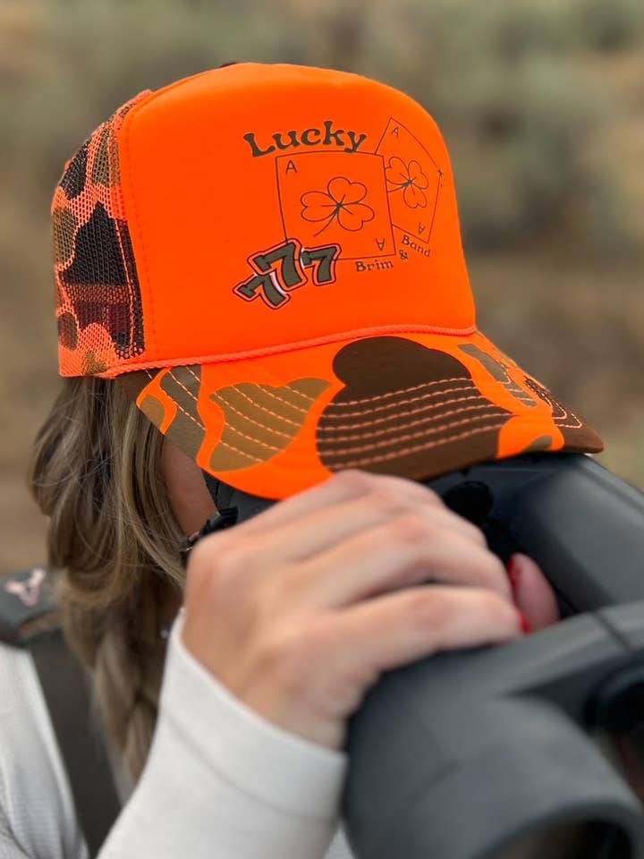 Orange Lucky Camo Foam Trucker Hat for wholesale by Brim + Band