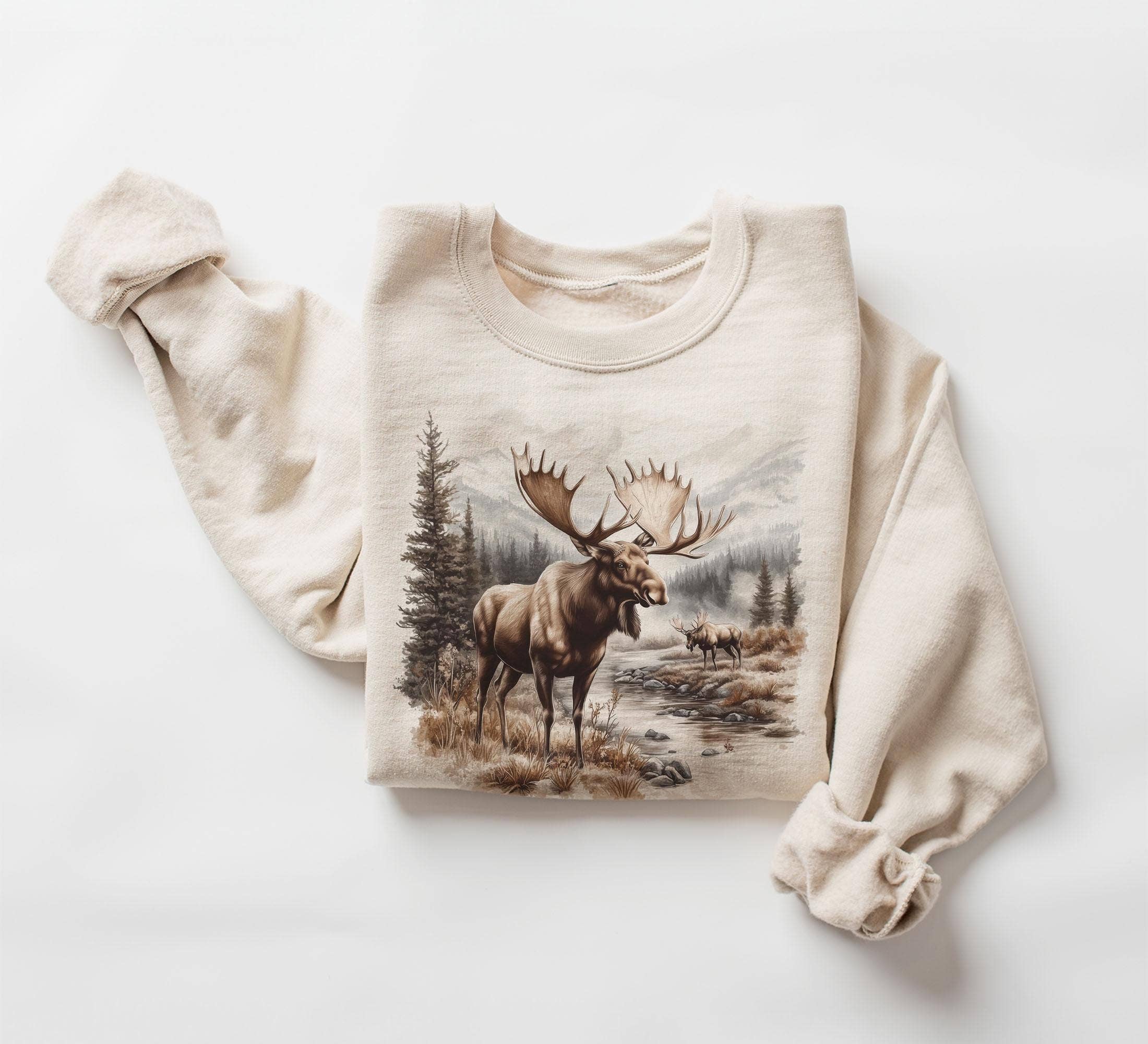 NVC Ecommerce LLC - Wholesale T-Shirt (Graphic) - Women's - Retro Bull Moose Wilderness Scene Tee, Winter Sweater