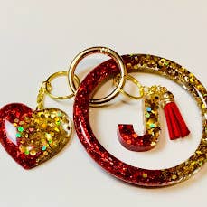 Set di braccialetti portachiavi con glitter rossi e dorati per la vendita all'ingrosso da parte di Shop Drip Express