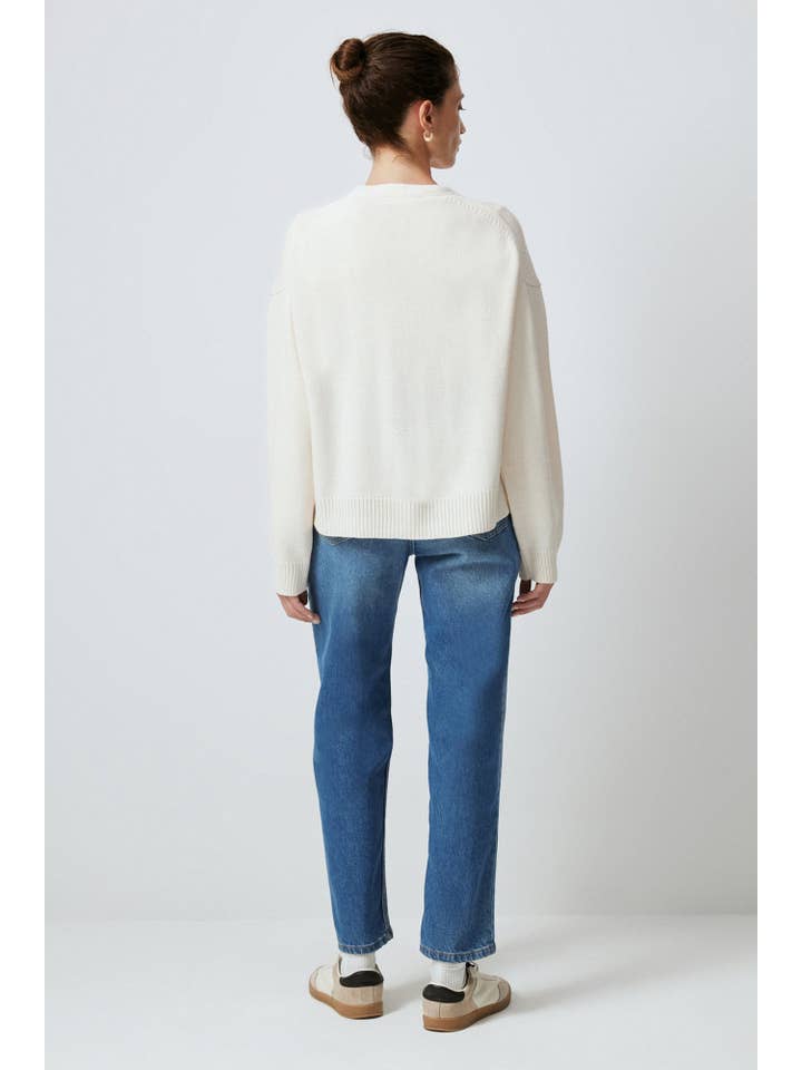 Cream A KNIT CARDIGAN WITH BUTTON POCKET DETAILS for wholesale on Faire3