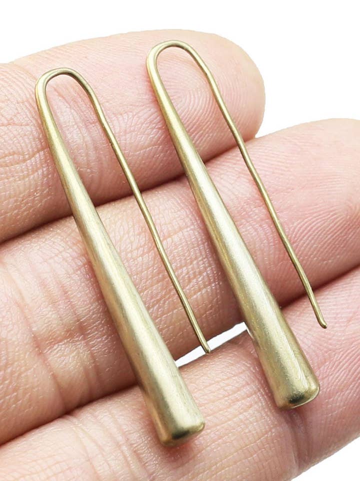 Long brass teardrop hoops for wholesale by Modern Madini
