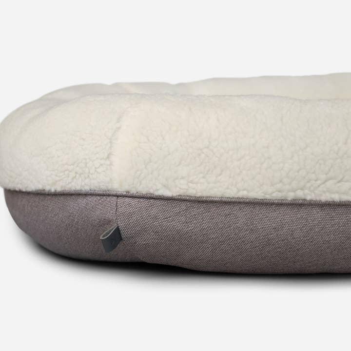 Beige Letto per cani a ciambella beige peloso in vendita all'ingrosso su Faire5