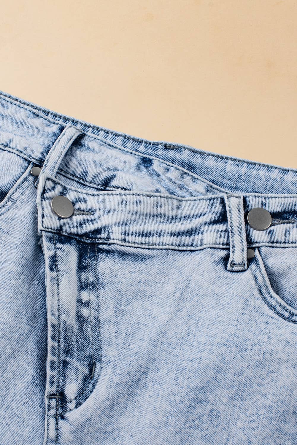 Light Blue Acid Wash Crossed Raw Edge Denim Shorts for wholesale on Faire2