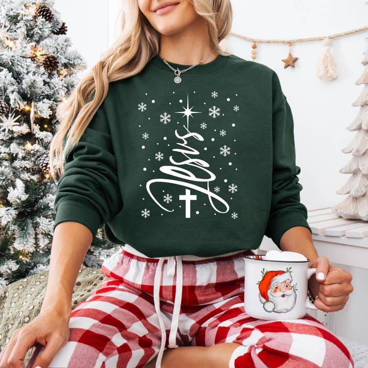 Jesus Snow Christmas Tree Graphic Sweatshirt for wholesale by Wholehearted Motherhood and Co.