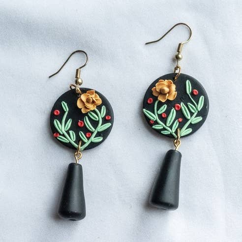 Boucles d'oreilles pendantes en perles avec pendentif fleur pour la vente par Eleven Suns Jewelry