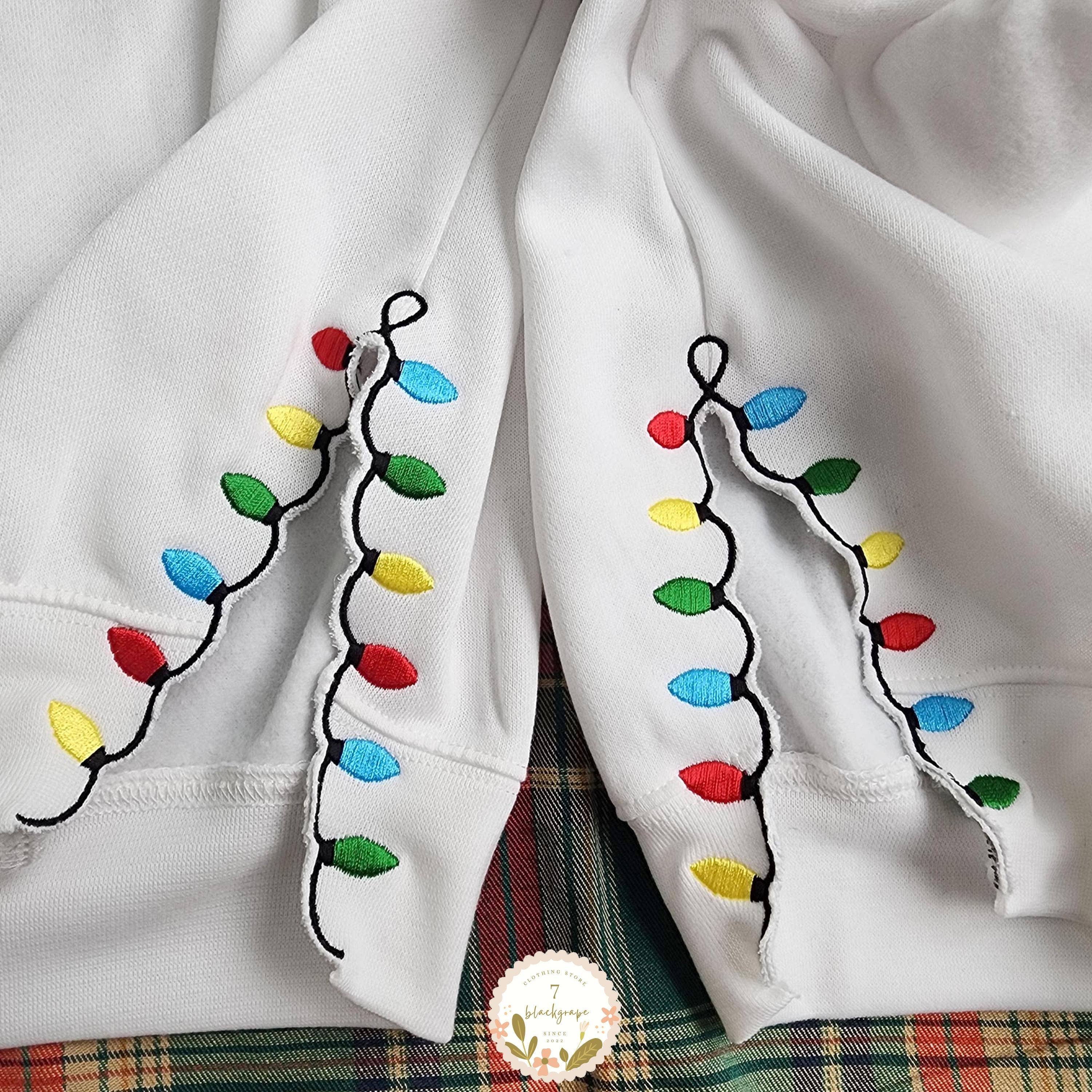 NVC Ecommerce LLC - Wholesale Grafisch sweatshirt - Dames - Vrolijke en Heldere Strik, Geborduurde Zijstrik Sweater1