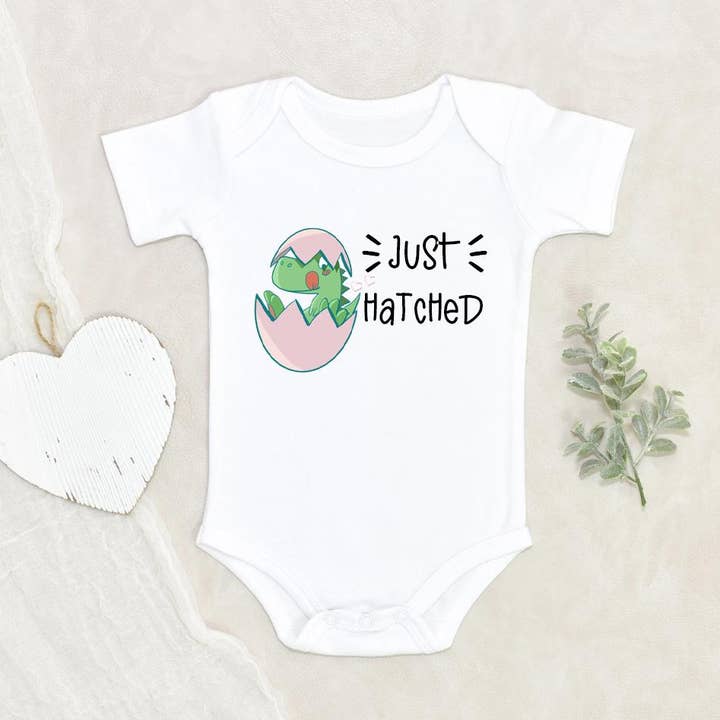 Dinosaur Egg Baby Onesie for wholesale by NewBabyWishes