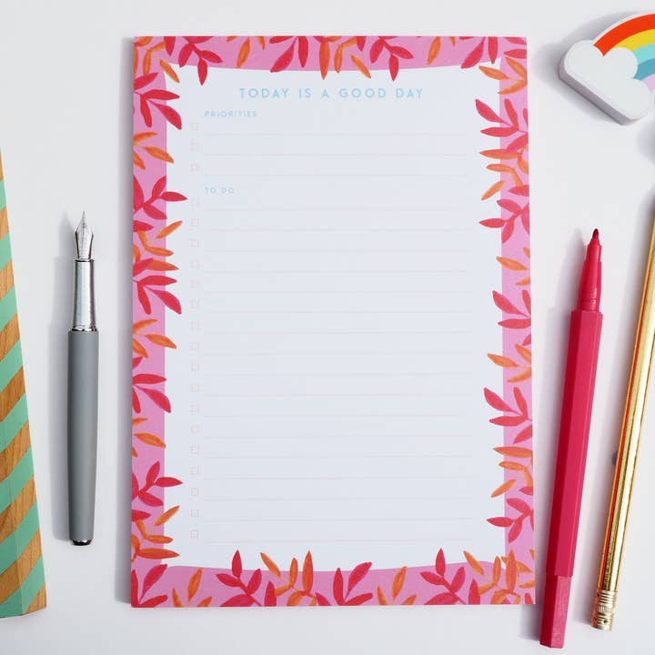 Blocco note A5 a righe in grassetto arancione e rosa per la vendita all'ingrosso da parte di Little Fish Stationery